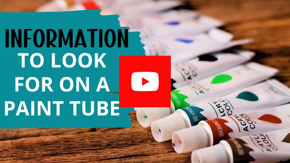 Paint tubes lined up on a wooden table with an overlay of a YouTube play button. The text reads information to look for on a paint tube.