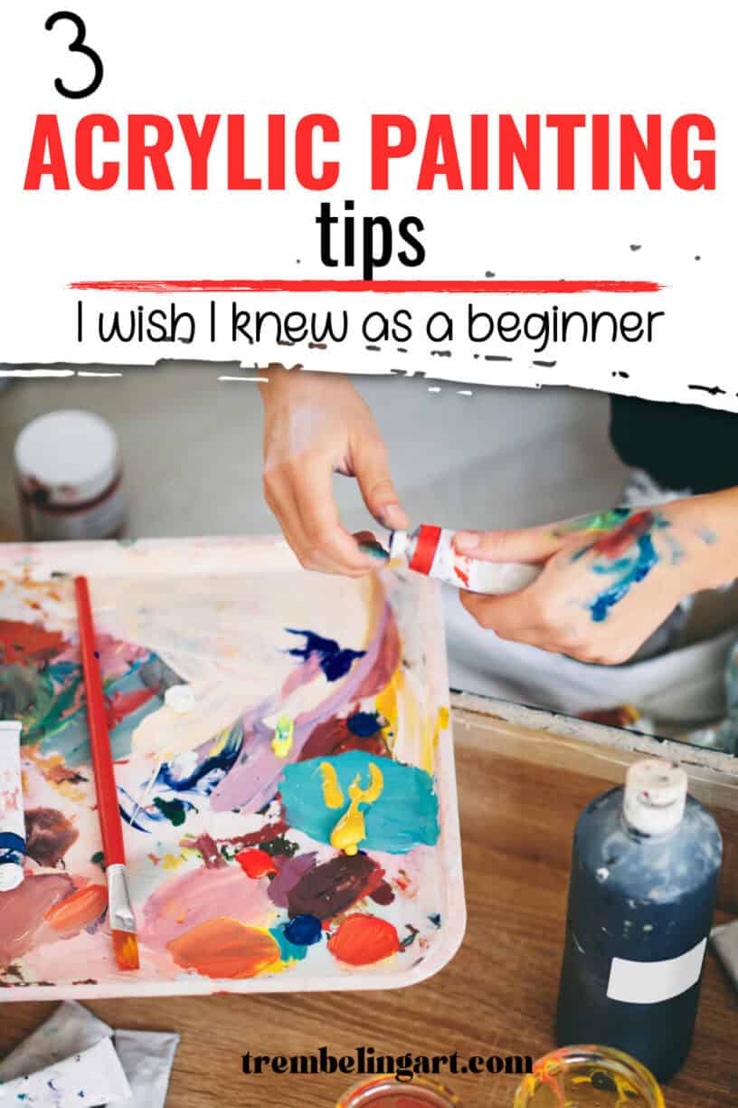 An artist opening a tube of paint and a paint palette covered in various colours of paint on a wooden table. The text reads 3 acrylic painting tips I wish I knew as a beginner.
